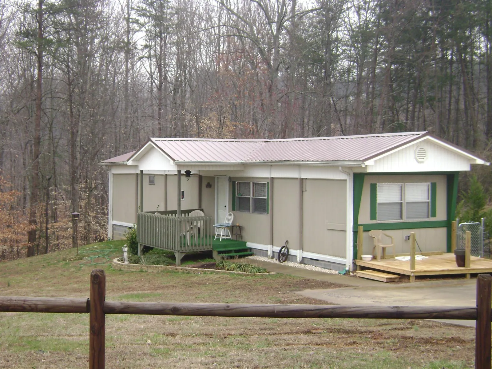Mauve metal roof on a manufactured home with a new front deck in Georgetown